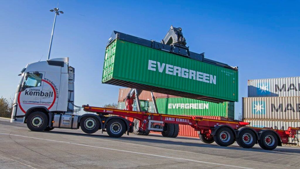 James Kemball truck with evergreen container being loaded on top